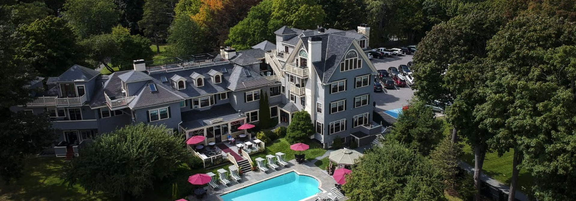 Aerial view of Balance Rock Inn, its pool and tree-lined grounds
