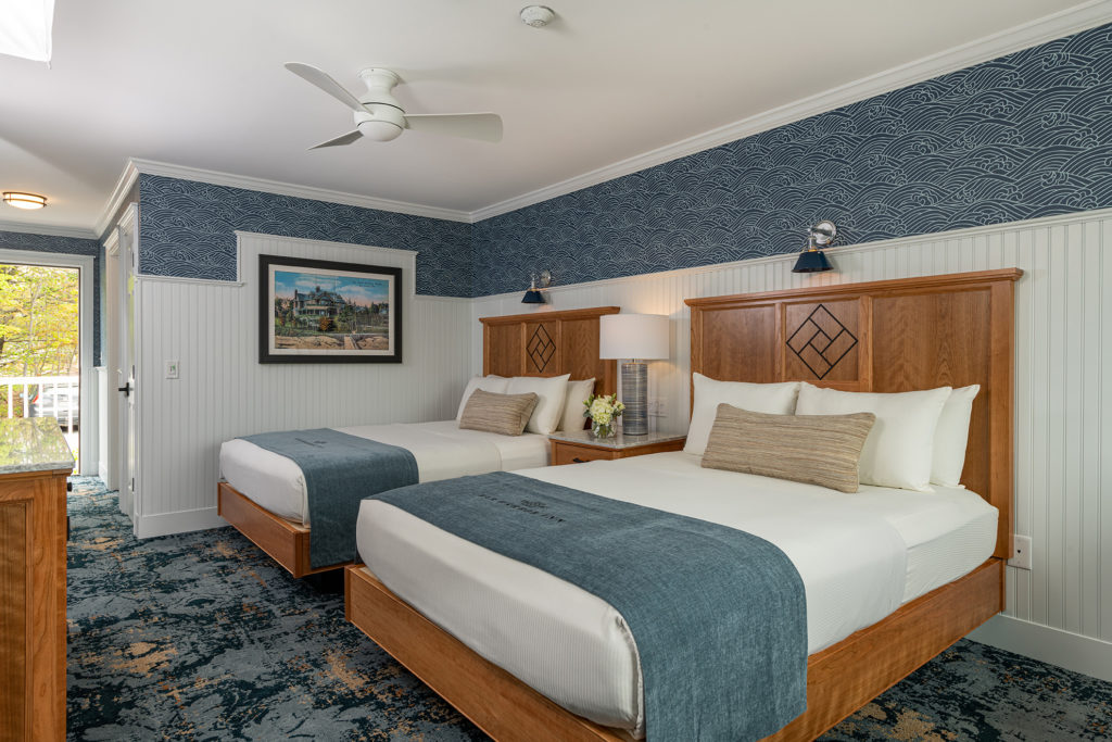 Bar Harbor Inn guest room with two beds and coastal blue accents