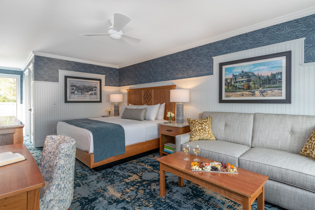 Bar Harbor Inn guest room with a bed, sofa and writing desk